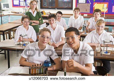Students performing science experiments in classroom View Large Photo Image Stock Image - Students performing science experiments in classroom. Fotosearch