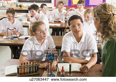 Students performing science experiments in classroom View Large Photo Image Stock Photo - Students performing science experiments in classroom. Fotosearch