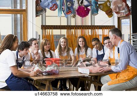 Stock Photo - Students receiving art lessons. Fotosearch