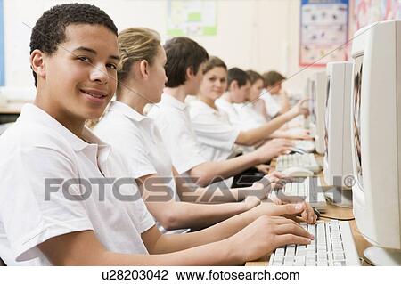 Students working on computer workstations View Large Photo Image Stock Image - Students working on computer workstations. Fotosearch