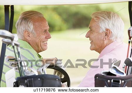Stock Photograph - Male Friends Enjoying A Game Of Golf. Fotosearch