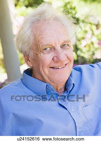 Stock Photograph - Senior man sitting outdoors. Fotosearch