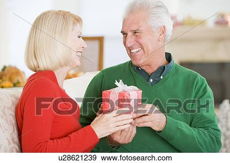 Mature Couple At Christmas View Large Photo Image Stock Photo - Mature Couple At Christmas. Fotosearch