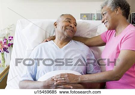 Stock Photography - Senior Couple In Hospital Room. Fotosearch