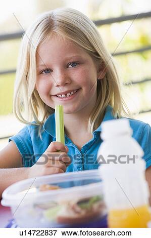 Student outdoors eating lunch (selective focus) View Large Photo Image Stock Photo - Student outdoors eating lunch (selective focus). Fotosearch