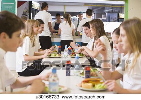 Students having lunch in dining hall View Large Photo Image Stock Image - Students having lunch in dining hall. Fotosearch