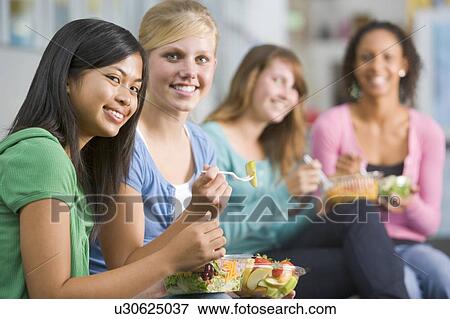 Stock Photo - Students having lunch. Fotosearch