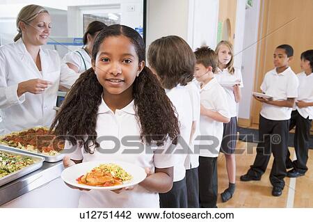 Students in cafeteria line with one holding her healthy meal and looking at camera (depth of field) View Large Photo Image Stock Image - Students in cafeteria line with one holding her healthy meal and looking at camera (depth of field). Fotosearch