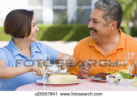Couple Enjoying A Barbequed Meal In The Garden View Large Photo Image Stock Image - Couple Enjoying A Barbequed Meal In The Garden. Fotosearch