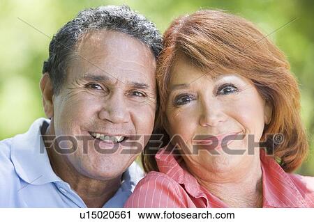 Couple outdoors smiling View Large Photo Image Stock Image - Couple outdoors smiling. Fotosearch