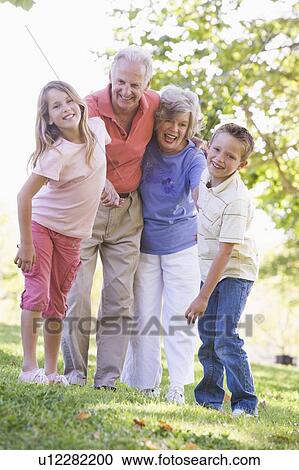Grandparents laughing with grandchildren. View Large Photo Image Stock Image - Grandparents laughing with grandchildren.. Fotosearch
