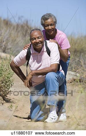 Senior couple on a walking trail View Large Photo Image Stock Photo - Senior couple on a walking trail. Fotosearch