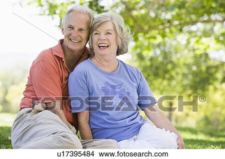 Senior couple sitting outdoors View Large Photo Image Picture - Senior couple sitting outdoors. Fotosearch