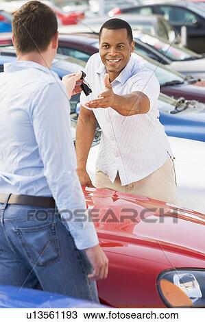Man shopping for a new car View Large Photo Image Stock Image - Man shopping for a new car. Fotosearch