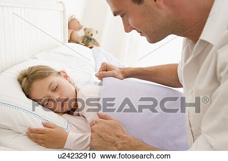 Man waking young girl in bed smiling View Large Photo Image Stock Image - Man waking young girl in bed smiling. Fotosearch