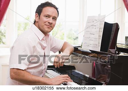 Man playing piano View Large Photo Image Stock Photography - Man playing piano. Fotosearch