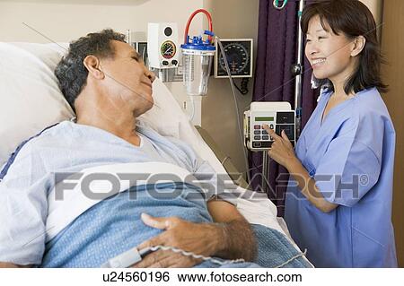 Stock Photograph - Doctor And Patient Talking To Each Other. Fotosearch