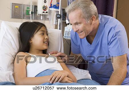 Stock Photo - Doctor Checking Up On Patient. Fotosearch