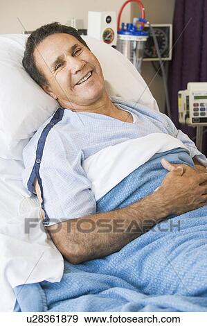 Middle Aged Man Lying In Hospital Bed View Large Photo Image Stock Photo - Middle Aged Man Lying In Hospital Bed. Fotosearch