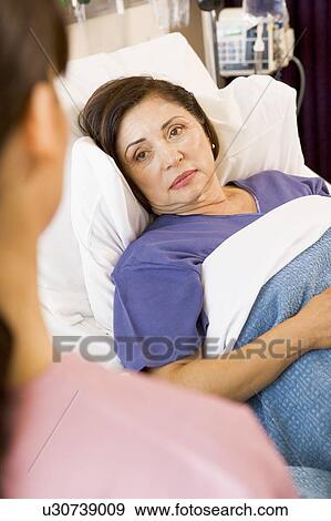 Patient Lying In Hospital Bed View Large Photo Image Stock Photo - Patient Lying In Hospital Bed. Fotosearch