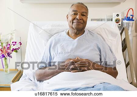 Stock Photography - Senior Man Sitting In Hospital Bed. Fotosearch