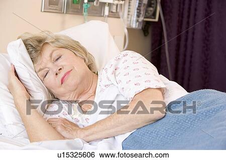 Senior Woman Sleeping In Hospital Bed View Large Photo Image Stock Photograph - Senior Woman Sleeping In Hospital Bed. Fotosearch