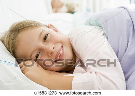 Young Girl Lying Down In Her Bed View Large Photo Image Stock Image - Young Girl Lying Down In Her Bed. Fotosearch