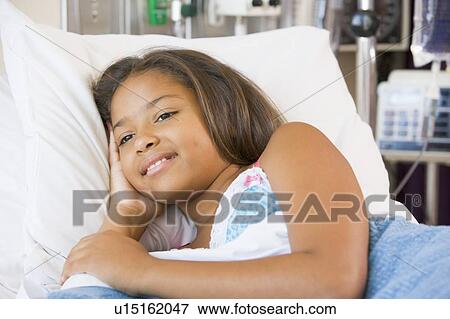 Young Girl Lying Down In Hospital Bed View Large Photo Image Stock Photo - Young Girl Lying Down In Hospital Bed. Fotosearch
