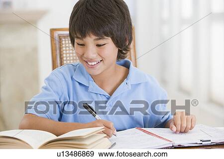 Boy Doing His Homework View Large Photo Image Stock Photo - Boy Doing His Homework. Fotosearch