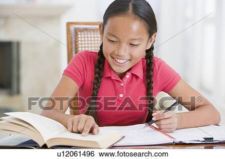 Stock Photograph - Girl Doing Her Homework. Fotosearch