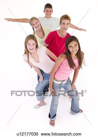 Stock Photography - Five friends in a row smiling. Fotosearch