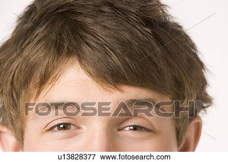 Stock Photo - Close Up Teenage Boy's Eyes. Fotosearch