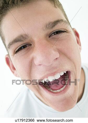 Teenage boy shouting View Large Photo Image Stock Photograph - Teenage boy shouting. Fotosearch
