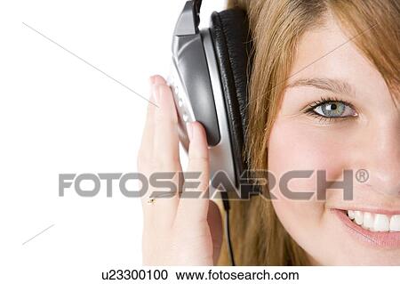 Stock Image - Teenage Girl Listening To Music. Fotosearch