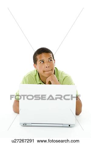 Stock Image - Portrait Of Teenage Boy On His Laptop. Fotosearch