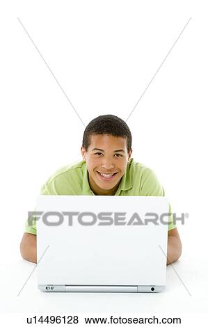 Stock Photo - Portrait Of Teenage Boy On His Laptop. Fotosearch
