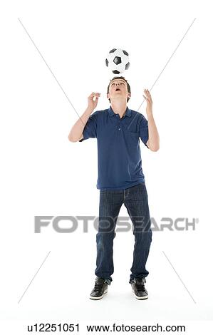 Stock Image - Portrait Of Teenage Boy With A Soccer Ball. Fotosearch