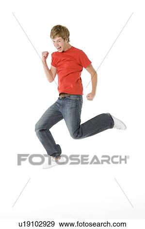 Teenage Boy Jumping In The Air View Large Photo Image Stock Photo - Teenage Boy Jumping In The Air. Fotosearch