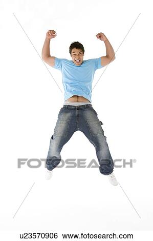 Stock Photograph - Teenage Boy Jumping In The Air. Fotosearch