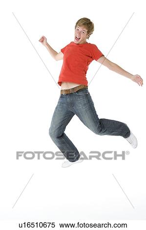 Teenage Boy Jumping In The Air View Large Photo Image Stock Photography - Teenage Boy Jumping In The Air. Fotosearch