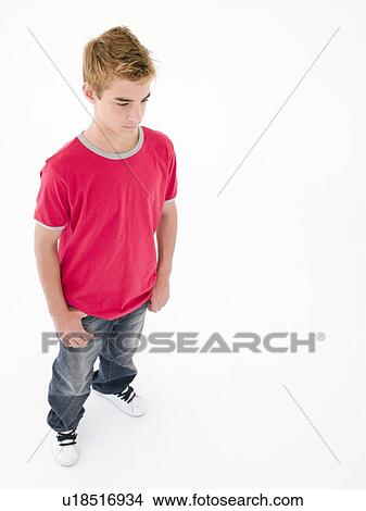 Picture - Teenage boy looking down. Fotosearch