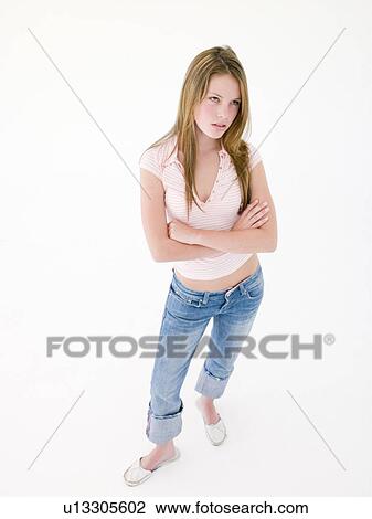 Teenage girl with arms crossed frowning View Large Photo Image Stock Image - Teenage girl with arms crossed frowning. Fotosearch