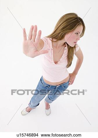 Picture - Teenage girl with hand up. Fotosearch