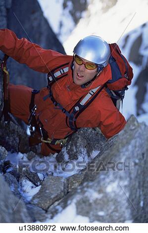 Mountain climber going up snowy mountain (selective focus) View Large Photo Image Stock Image - Mountain climber going up snowy mountain (selective focus). Fotosearch