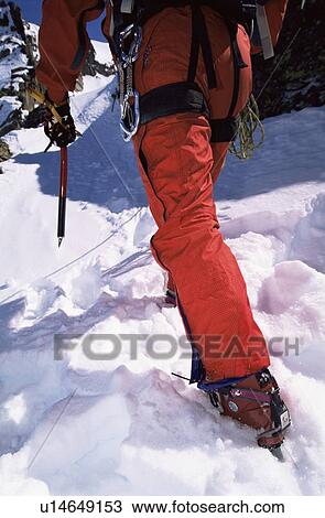 Mountain climber going up snowy mountain (selective focus) View Large Photo Image Stock Image - Mountain climber going up snowy mountain (selective focus). Fotosearch