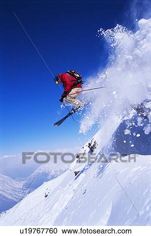 Skier jumping on snowy hill View Large Photo Image Stock Image - Skier jumping on snowy hill. Fotosearch