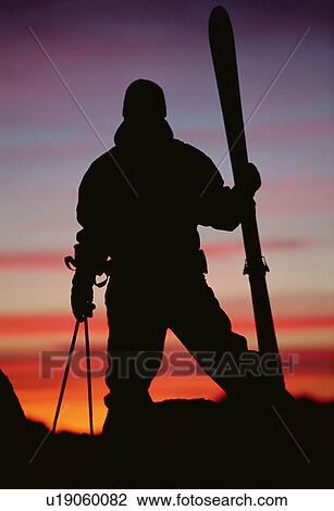 Skier standing outdoors at dusk (silhouette) View Large Photo Image Stock Image - Skier standing outdoors at dusk (silhouette). Fotosearch