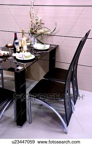 Stock Photo - Luxurious dining room with place setting. Fotosearch