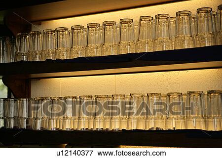 Close-up of wineglasses in a row View Large Photo Image Stock Photo - Close-up of wineglasses in a row. Fotosearch