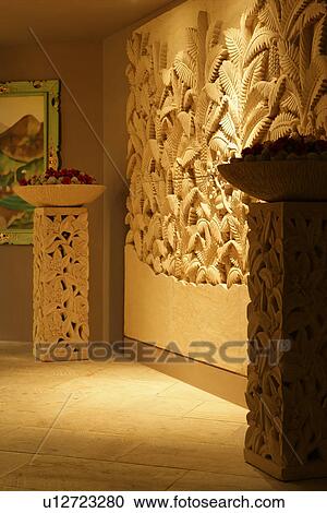 Stock Image - Home decorating of wall carving and carved sculptures. Fotosearch